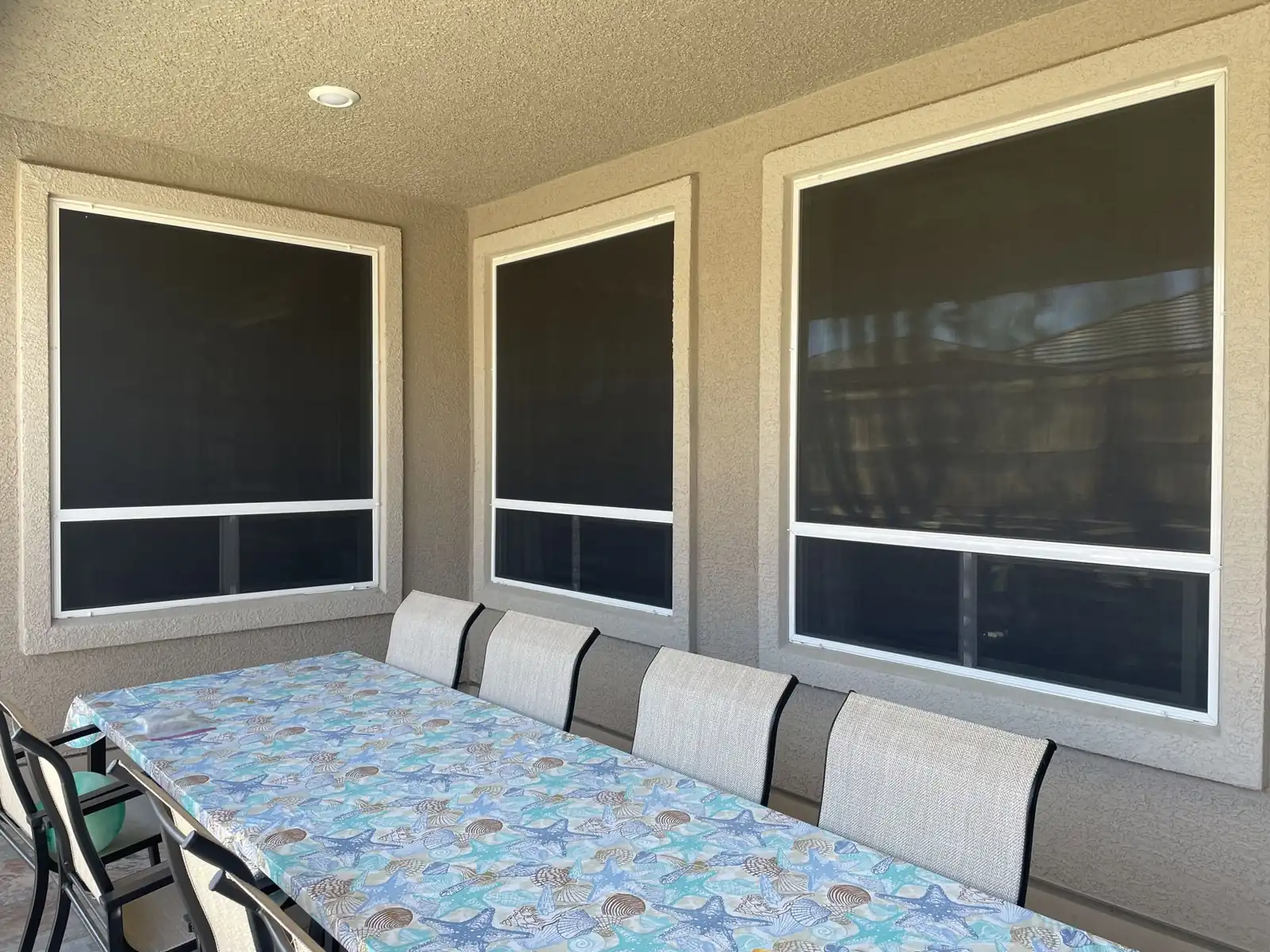 After: solar screens on three patio windows